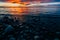 Pebbles on the shore of Lake Baikal against the backdrop of the sunset