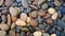 Pebbles stone nature background, colorful pebble beach stone outdoor garden