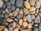 Pebbles stone nature background, colorful pebble beach stone outdoor garden