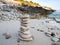 Pebbles tower on a sandy beach