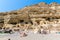 Pebbly beach Matala, Greece Crete. Matala has become famous for artificial Neolithic caves, carved in limestone rocks.