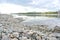 Pebbly lake shore on a summer afternoon