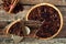 Pecan cranberry pie, overhead rustic table scene with cut slice