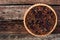 Pecan and cranberry pie on rustic wood background