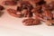 Pecan nuts are scattered on a wooden surface close-up. Healthy food background, brown color toned