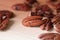 Pecan nuts are scattered on a wooden surface close-up. Healthy food background, brown color toned
