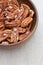 Pecan nuts in wooden bowl