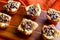 Pecan Pie Tartelettes Served on a Wooden Cutting Board