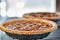 Pecan pies cooling on a rack