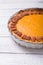 Pecan, Pumpkin, Thanksgiving Holiday Pies on a rustic table with decorative gourds. Top view