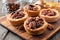 Pecan tarts close up on a wooden server