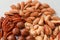 Pecans, brazil nuts, cashews, almonds and macadamia nut. Proper nutrition composition of assorted nuts pattern vertical photo for