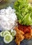 Pecel ayam is typical Indonesian dish,  consisting of vegetables,  fried chicken and spicy chilli sauce