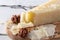 Pecorino romano, hard italian sheep milk cheese on wooden cutting board, selective focus