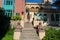 Pecs, Hungary - 21.08.2020: Beautiful colorful building in the famous colorful Zsolnay quarter in PÃ©cs with a toursit woman