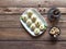 Peda Indian sweet, Milk Fudge with tea cup in a dark wooden table. Top view