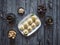 Peda Indian sweet, Milk Fudge with tea cups in a dark wooden table. Top view