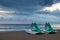 Pedal boats on the beach at dawn on cloudy morning ocean sunrise at Rivazzurra Rimini/Italy adriatic coastline