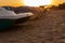 Pedal boats on the sunset on a tropical island beach. Colorful catamaran on an empty sea shore on evening landscape