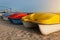 Pedal boats on the sunset on a tropical island beach. Colorful catamaran on an empty sea shore on evening landscape