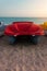 Pedal boats on the sunset on a tropical island beach. Colorful catamaran on an empty sea shore on evening landscape