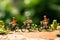 Pedaling joy Miniature people on bicycles with a green bokeh backdrop