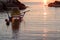 Pedalo moored in the sea at sunrise