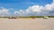 Pedalos and kayaks on a gravel beach