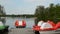 Pedals boat and wooden bridge in spring lake