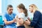 Pedeatrician african doctor examining little girl with stethoscope