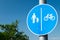 Pedestrian/bike sign against blue sky