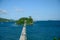 pedestrian bridge between islands skyline sunny day