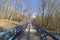 A pedestrian bridge laid the bottom of a small ravine