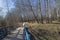 A pedestrian bridge laid the bottom of a small ravine