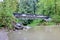 Pedestrian Bridge Over Forested Stream