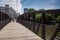 Pedestrian bridge over a pond in a park in West Midtown Atlanta