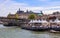 Pedestrian bridge Passerelle LÃ©opold-SÃ©dar-Senghor over Seine river, boats and historic buildings of Paris France