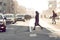 Pedestrian crossing in the city, cars and people, blurry picture, toning