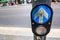 Pedestrian crossing control button at intersection.