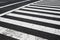 Pedestrian crossing, zebra traffic walk way on asphalt road