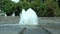 Pedestrian fountain cascading in the city in sunny weather.