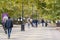 Pedestrian Lenin Street in center of Kerch city. People calmly walk along shady alley of tall plane trees