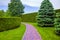 Pedestrian path made of red stone tiles.