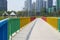 A pedestrian rainbow bridge over the city river