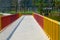 A pedestrian rainbow bridge over the city river