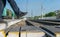 Pedestrian`s feet step on a pedestrian crossing through the rails at the railway station