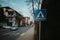 Pedestrian signage on a street with cars background