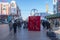 A pedestrian street in China with a lot of masked people on their faces in winter