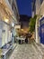 Pedestrian streets of Hydra island at night. View of the center of Hydra as tourists walk around enjoying life and the atmosphere