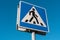 Pedestrian transit traffic sign on blue sky background